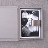 Image of couple in black & white with box